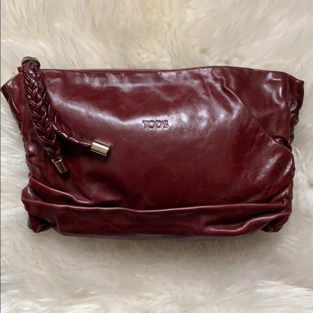 Authentic Tod’s Leather Burgundy Clutch